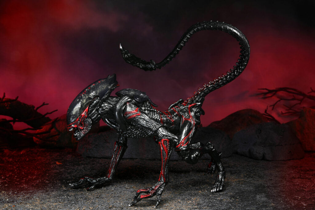 Dark, alien-like creature with red accents on a dark background