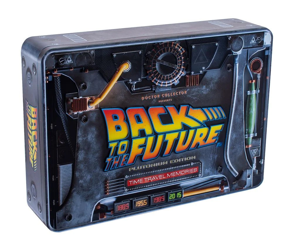 A retro-themed collectible card reader device styled like a 'Back to the Future' Time Travel Vembo, featuring a dark metallic gray body with orange, yellow, and red accents, and the 'Back to the Future' logo on the front.