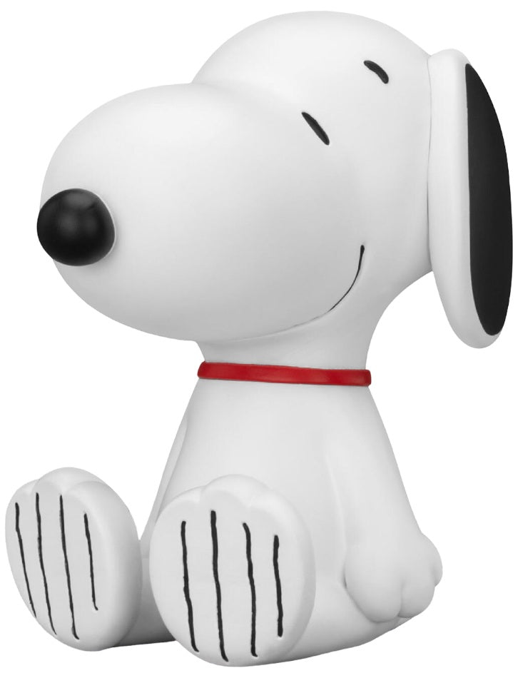 Snoopy figurine with black nose and red collar on a white background