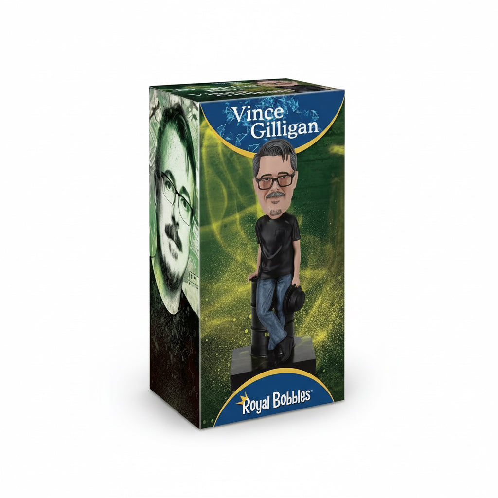A bobblehead figure of Vince Gilligan from the TV show Breaking Bad, produced by Royal Bobbles. The figure is packaged in a collector's box with a custom-cut Styrofoam inner protection, featuring a colorful, printed design.
