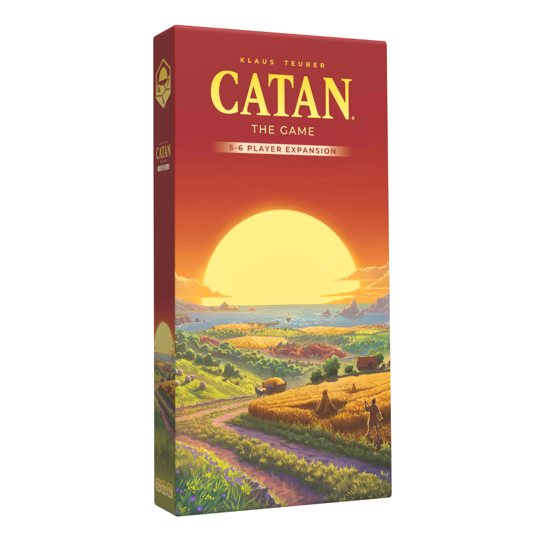 Catan board game expansion box with sunset over a village scene