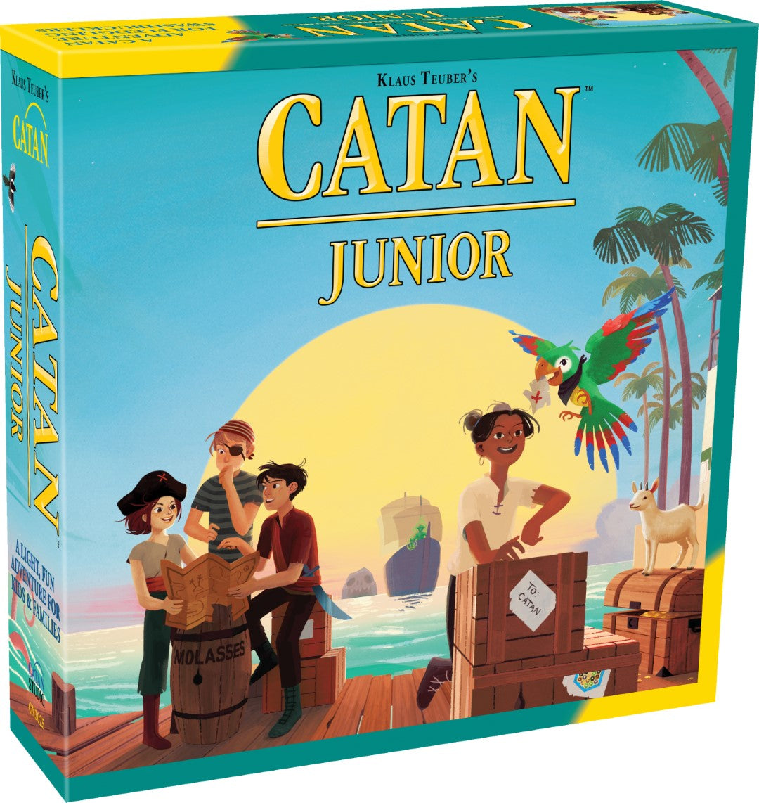 Box cover for Catan Junior board game featuring illustrations of characters and a tropical setting with a boat and parrot.