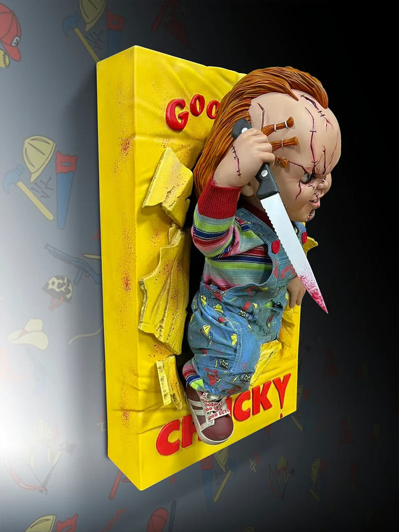 Chucky doll figure emerging from a yellow box with 'Good Guy Chucky' text on a dark background.