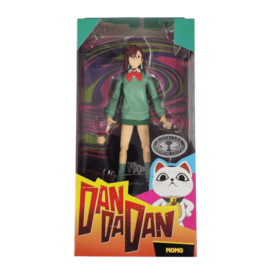 Dan Da Dan/McFarlane Toys branded packaging with clear window. Inside box is mono Dan Da Dan chase figure, with green sweater, green skirt, brown hair and red bowtie.