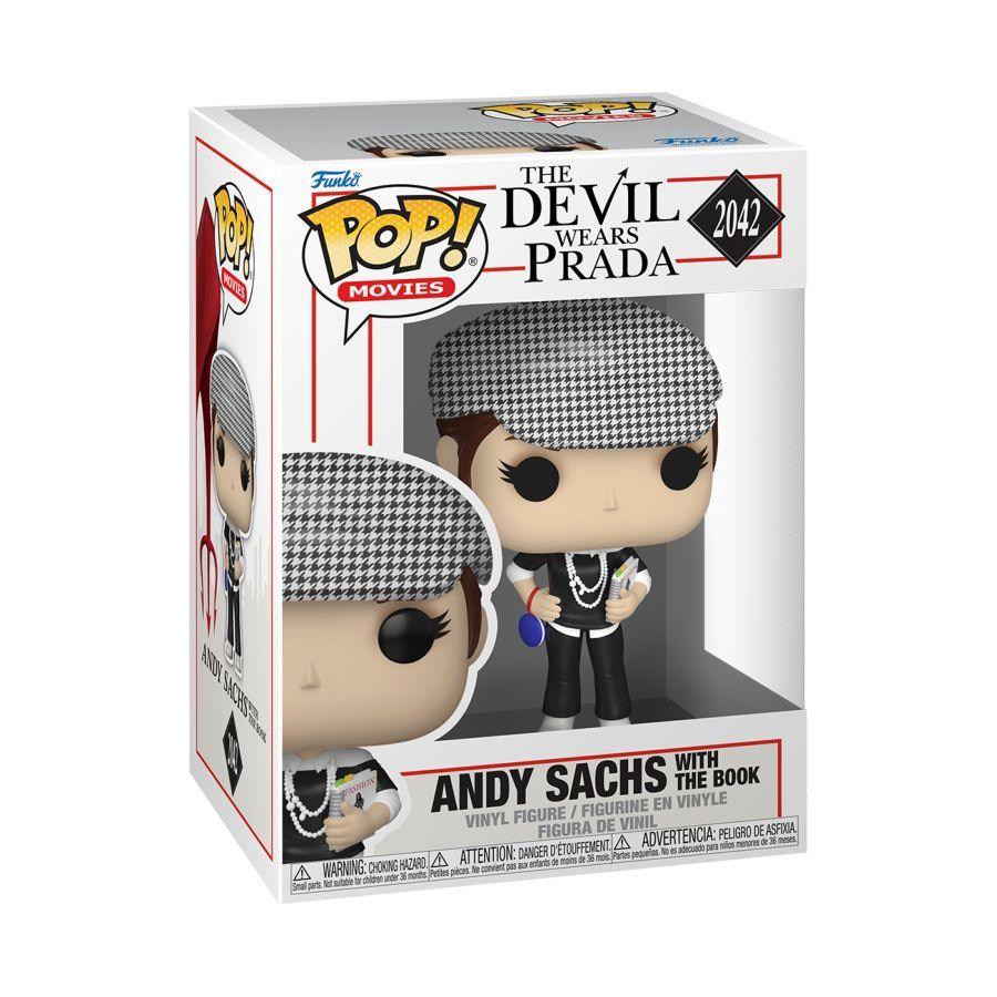Funko branded packaging with clear window and figure inside. Figure is holding "Fashion" book with white heels, pearl necklaces and more. 