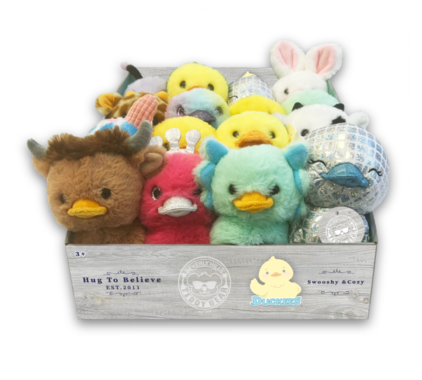 Box of colorful plush ducks with various designs on a white background.