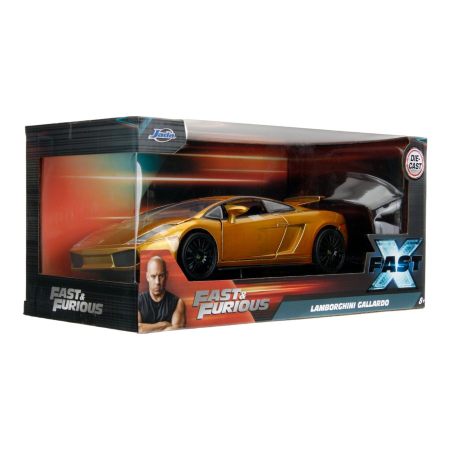 Image shows a gold Lamborghini Gallardo in diecast packaging. Fast & Furious 10 - Lamborghini Gallardo (Gold).