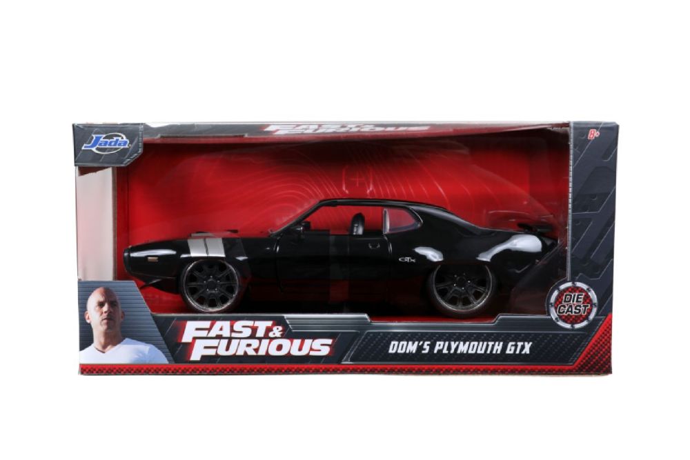 Jada branded packaging with a clear window and red background. Inside box is black metal model of a Plymouth GTX.