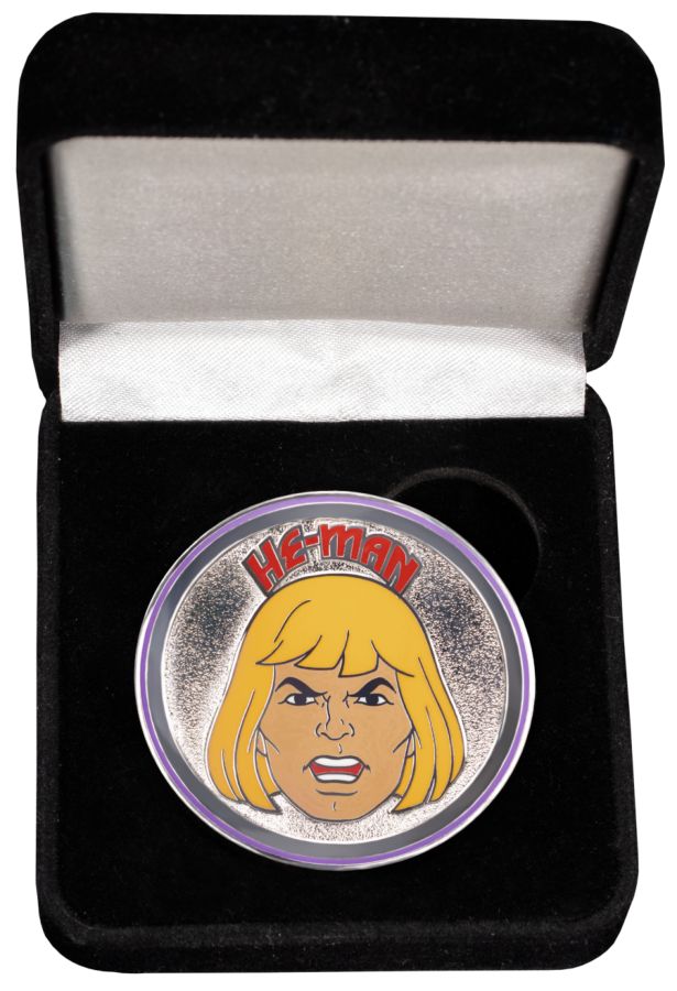 Image shows, collectable token of he-man in a velvet box. 