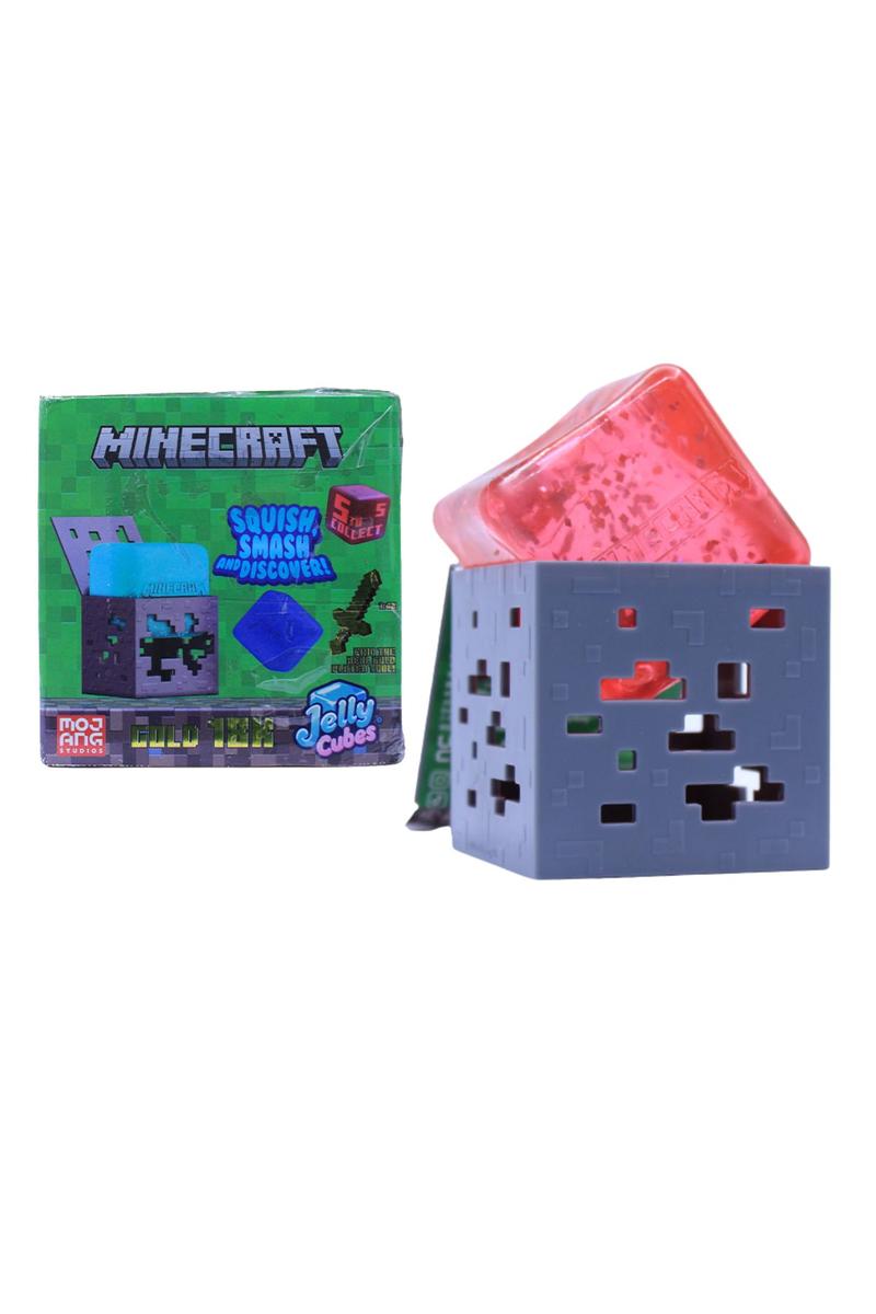 Minecraft-themed toy cube with colorful light-up top next to its packaging on a white background
