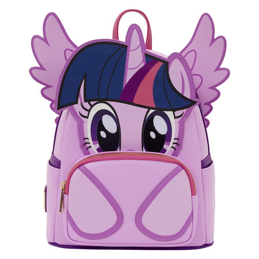 White background with purple twilight sparkle backpack at the forefront. Bag is complete with moveable purple wings, pink zipper and pink bag loop.
