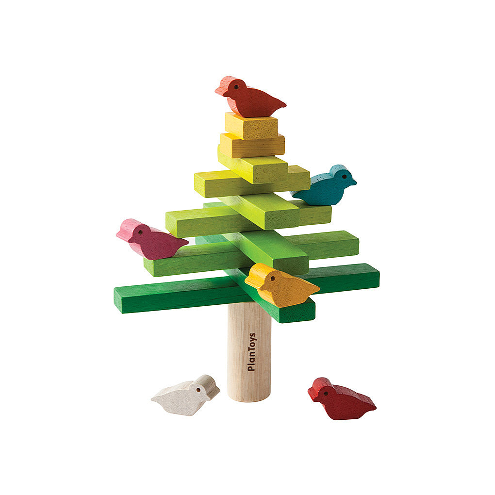 Wooden toy with colorful blocks and bird figures on a white background. PlanToys Balancing Tree.