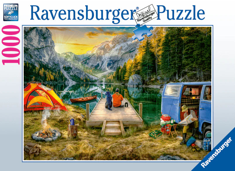 Ravensburger branded box with finished puzzle on cover. Image shows a campsite by the river with a pet dog. 