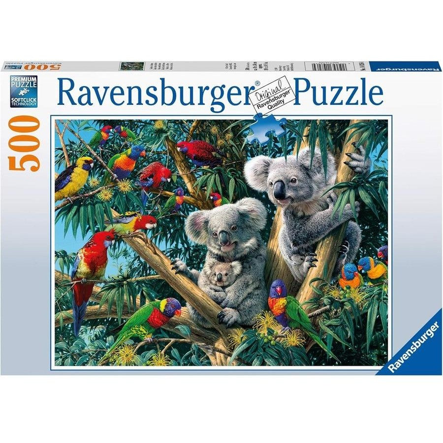 Ravensburger branded box with finished puzzle image. Image shows two adult koalas with baby, rainbow lorikeets, Rosellas, gumtree and more.