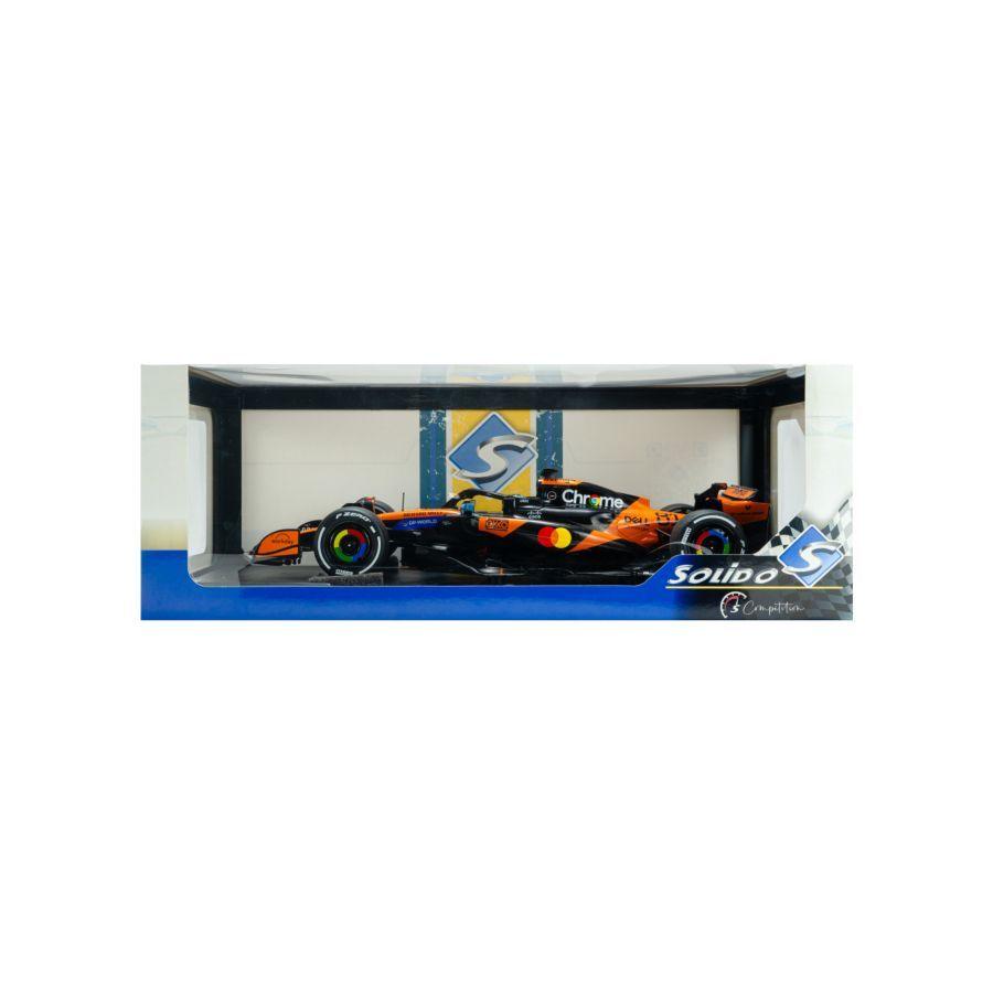 Model Formula 1 car in a display case with branding on a white background