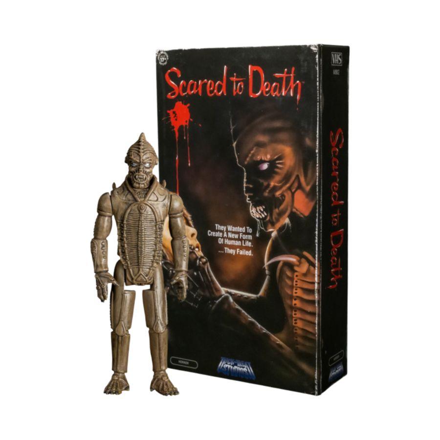 Action figure of a creature from 'Scared to Death' with its packaging on a white background