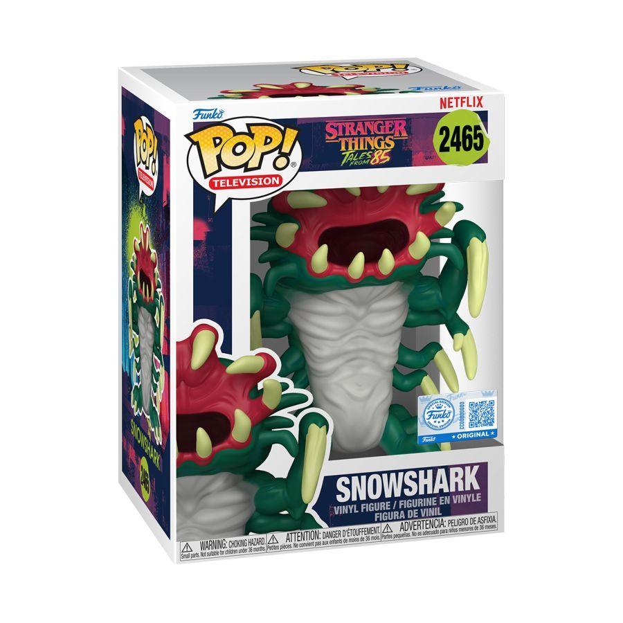 Funko branded packaging with clear window. Inside is green,red and white Snowshark figure with sharp teeth.
