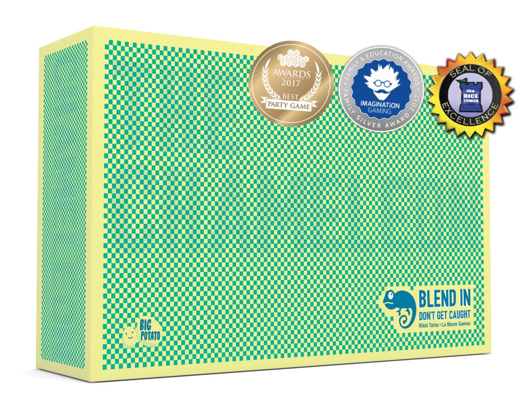 The image shows a boxed version of 'The Chameleon Game' with a green geometric pattern. The box features a gold award badge, a silver award badge, and a 'Blend In' game description.