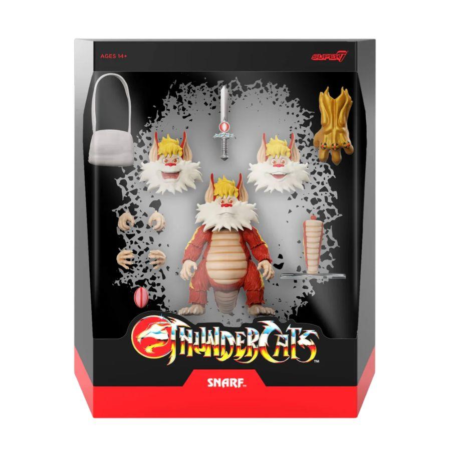 Black and red Thundercats branded packaging with clear window. Inside box is Snarf action figure with changeable hands and head.