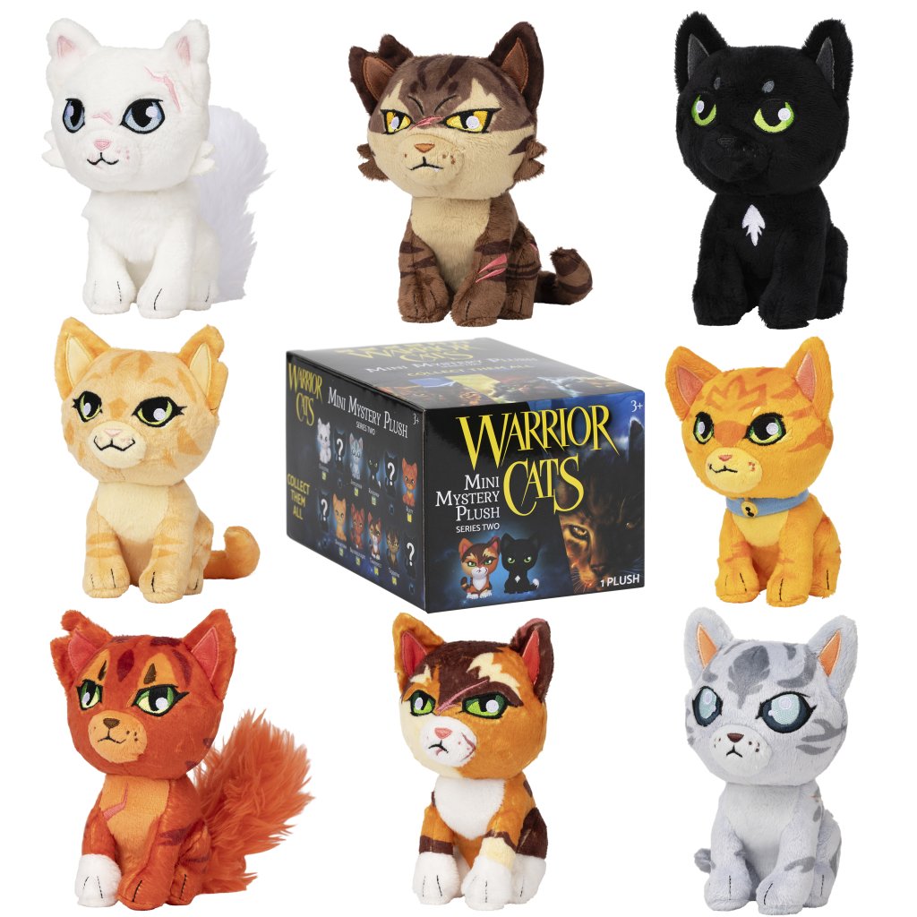 Warrior cats branded box, surrounded by plush cats with a white background. 