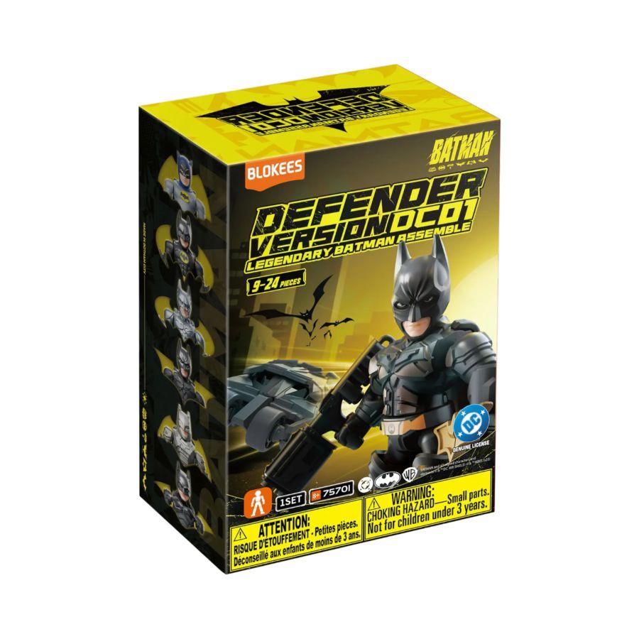Boxed toy figure of a superhero in black and yellow packaging