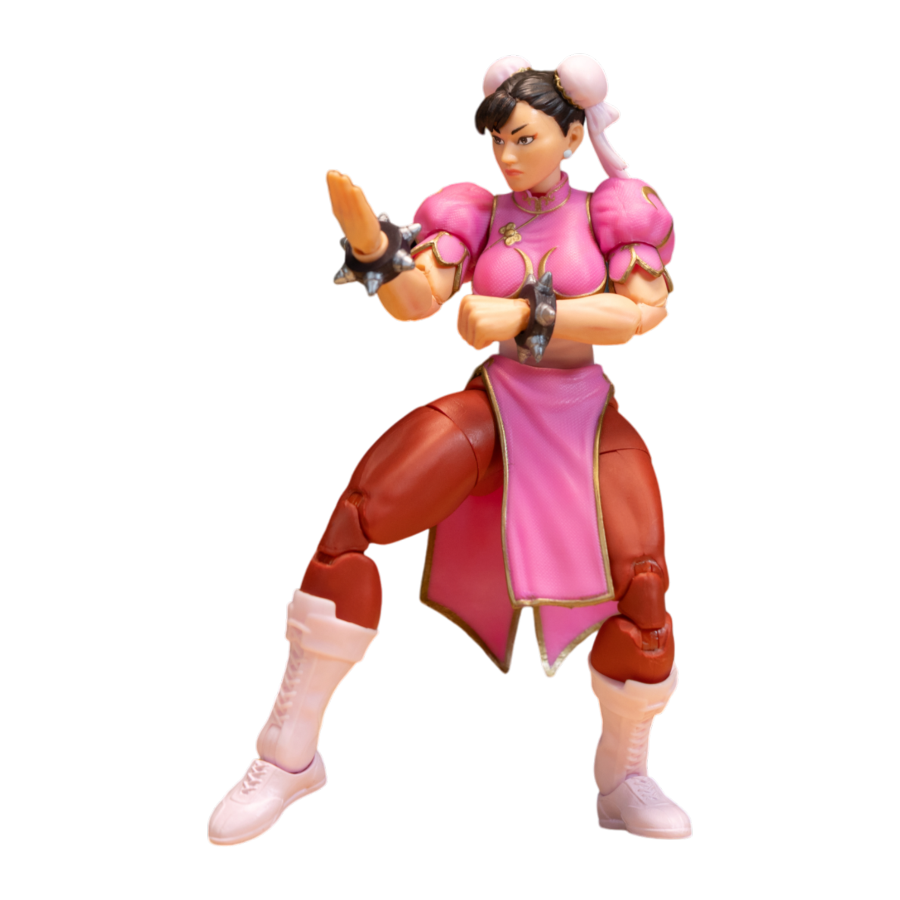Action figure in pink and brown outfit with weapon on a white background